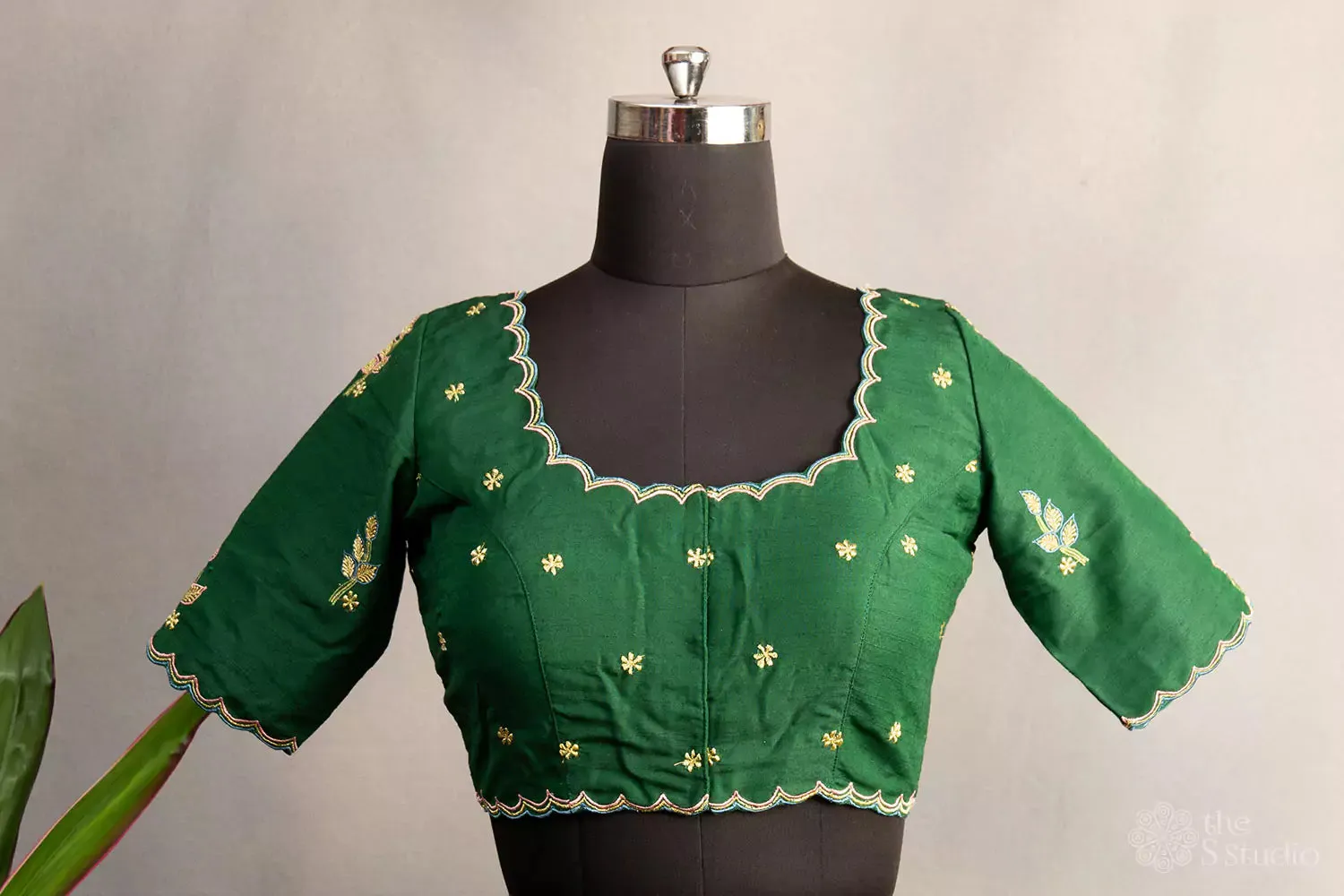 Green hand embroidered cotton blouse with scallop neck pattern